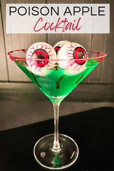 a green cocktail with eyeballs in it and the words, poison apple cocktail