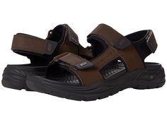 SKECHERS Arch Fit - Motley - Men's Shoes : Brown : Supportive all-day comfort and breezy style meet in the SKECHERS Arch Fit - Motley sandal. Podiatrist-designed shape developed with 20 years of data and 120,000 unweighted foot scans. Sporty casual comfort sandal. Leather and synthetic upper. Hook and loop strap closure. Patented SKECHERS Arch Fit insole system with podiatrist-certified arch support. Cushioned footbed helps mold to your foot to reduce shock and increase weight dispersion. Relaxe Casual Slip-resistant Sandals For Walking, Comfortable Non-slip Sandals For Walking, Open Toe Sport Sandals With Arch Support For Walking, Comfortable Walking Sandals With Branded Insole, Brown Slip-resistant Round Toe Sandals, Brown Casual Sport Sandals With Arch Support, Casual Brown Sport Sandals With Arch Support, Brown Slip-resistant Open Toe Sandals, Open Toe Synthetic Sport Sandals For Walking