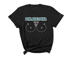 "Please help support this small business.  We make everything to order.  We print our shirts in house and ship.     100% preshrunk cotton     Seamless rib at neck     Taped shoulder-to-shoulder     Double-needle stitching throughout     Tear-away label     Quarter-turned to eliminate center crease     7/8\" collar     Classic fit" Philadelphia Eagles Shirts, Eagles Shirt, Football Team Shirts, Philadelphia Eagles Football, Cool Shirt Designs, Eagles Football, Unisex Gift, Team Shirt, Trendy Graphic Tees