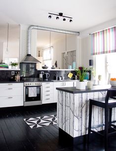 the kitchen is clean and ready to be used for cooking or baking, as well as other things in the room