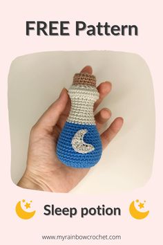 a hand holding a small crocheted bottle with the word free pattern on it