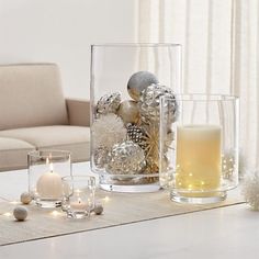 a table with candles and ornaments on it