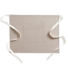 an apron with white straps is shown on a white background, and it has a square design in the middle