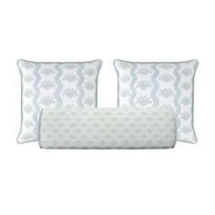 two pillows with blue and white designs on them