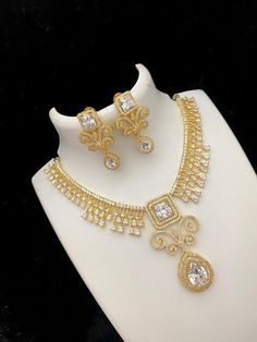 Amazing Design Designer necklace with AD CZ diamond stones set against 22k gold tone background. The necklace comes with matching pair of earrings. American Diamond Necklaces, Bangle Ring, Designer Necklace, Kundan Necklaces, Cz Jewelry, American Diamond, Cz Diamond, 22k Gold, Necklace Earring Set