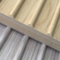 close up view of wood siding on a house's roof with metal slats