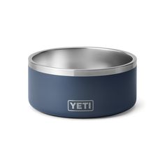 the yeti dog bowl is blue and has a stainless steel rim with a white logo on it