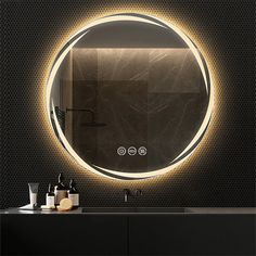 a bathroom with a round mirror above the sink