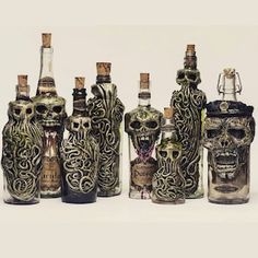 there are many bottles with designs on them