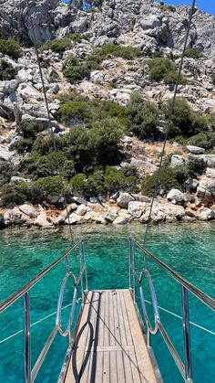 the deck of a boat in clear blue water