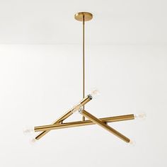 a gold chandelier with five lights hanging from it's center and four arms