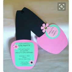 a pair of pink and black baby bibs