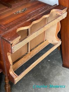 an old wooden desk with drawers on it