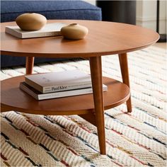 a coffee table with two books on it