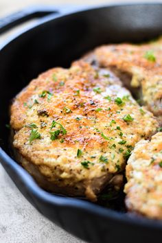 some meat patties are cooking in a skillet