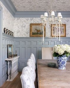 a dining room with blue and white walls