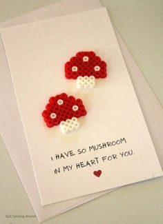 two red and white beads on top of a card with the words i have so mushroom in my heart for you