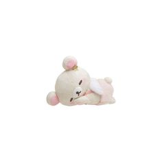 a small white stuffed animal with a pink bow on it's head, laying down