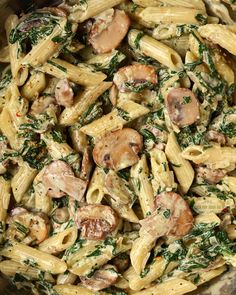 pasta with mushrooms and spinach in a bowl