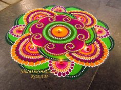 an artistically designed rangolite design on the ground for diwaling and decorating