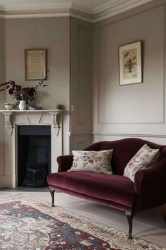 a living room filled with furniture and a fire place