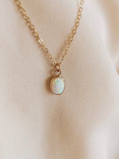 Opal pendant necklace gold White Opal Necklace With Delicate Chain, Delicate Gold Opal Necklace, Opal Jewelry With Delicate Chain As Gift, Delicate Opal Chain Jewelry As Gift, Delicate Opal Chain Jewelry Gift, Delicate Opal Chain Jewelry For Gifts, White Oval Necklace With Delicate Chain, Minimalist Gold Opal Necklace, Dainty White Opal Jewelry