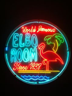 a neon sign that says world famous elbo room since 1933