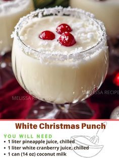 a white christmas punch with cherries in it