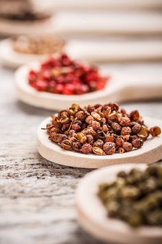 several bowls filled with different kinds of food on top of a marble countertop - stock photo - images