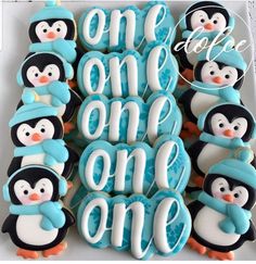 decorated cookies with penguins and the words one, one, one written in frosting