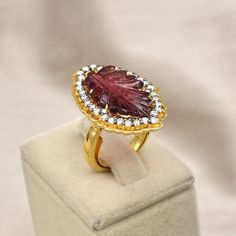 PRODUCT DETAILS PINK TOURMALINE LEAF  - PCS 1/ 9.95 CARATS  MOISSANITE CUT - PCS 32 / 1.00 CARATS GROSS WEIGHT - 11.25 GRAM 925 STERLING SILVER - 9.06 GRAM (GOLD PLATED) FINE OLD ANTIQUE STYLE CARVING RING SIZE US 6.5 SIZABLE RING FITTED IN THE RING BEST PRICE OFFERED EXCELLENT COLORS DIMENSION OF THE RING AFTER WEARING LENGTH - 32 MM/ WIDTH - 21 MM / HEIGHT - 6 MM NATURAL UNHEATED UNTREATED TOURMALINE  NOTE - #You will receive the same product you see in picture. #DEAR BUYERS PLEASE FEEL FREE TO ASK QUESTIONS  #WE WILL BE GLAD TO ANSWER & SOLVE QUERY REGARDING THIS PRODUCTS #RETURN POLICY Every piece of jewellery and inputs (gem stones, diamonds, making and setting) is tested by our team of experts and experienced artisans to generate maximum satisfaction to our valued customers. Customer Pink Tourmaline Ring, Statement Ring Silver, Ring Fit, Old Antiques, Multi Stone, Multi Stone Ring, Pink Tourmaline, Antique Style, Stone Rings