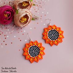 Beautiful orange yellow seed bead earrings, Boho style earrings, Dangle earrings, Fashion Earrings, Huichol bead earrings, Flower earrings, Native american earrings, Mexican seed bead earrings, Beadwork earrings. Size: Flower diameter 5 cm (1.96 inches) Materials: Rhodium plated ear hooks Czech glass beads Nylon Thread .. ready to be given away! Contact me if you have any questions. I will be happy to answer :) Please note that due to lighting effects, monitor's brightness, contrast and other se Orange Flower Earrings With Colorful Beads For Gift, Orange Jewelry With Tiny Beads For Crafting, Orange Round Beaded Earrings With Ear Wire, Handmade Orange Earrings With Round Beads, Orange Beaded Earrings With Tiny Round Beads, Handmade Orange Beaded Earrings As Gift, Orange Beaded Earrings With Round Beads, Orange Earrings With Tiny Round Beads, Huichol Earrings