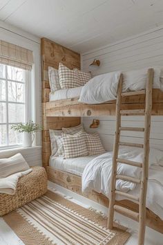 two bunk beds in a small room with white walls and flooring, one is made out of wood