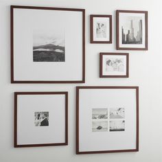 four framed photographs are hanging on the wall