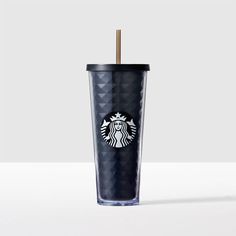 a starbucks cup with a straw in it