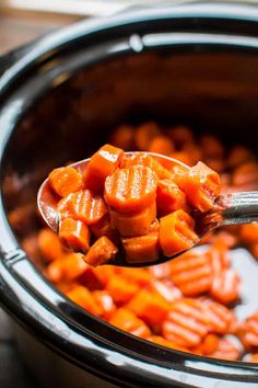 a spoon full of cooked carrots in an instant pot