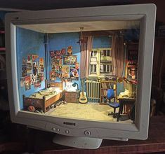 an old fashioned television with pictures on the screen