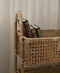 a wicker basket with books in it