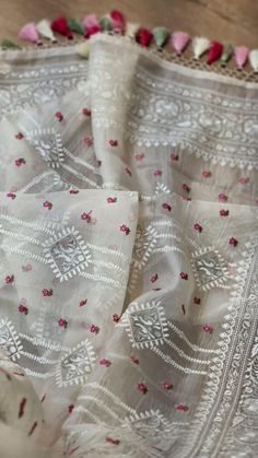 Beautifuly designed Primium Organza Saree with floral and leaf design handcrafted in pure white body with multicolored flower  design. Thin border and pallu ,exclusively designed with neat craftsmanship. Extremely beautiful Elegant looking Party ware designer saree with very light weight feather soft smooth felling texture,body hugging ,summer friendly. Saree comes with Running Blouse piece. Dry cleaning recommend only. Due to digital photography color variation is considerable. Exclusive pieces Saree Diwali, Diwali Saree, Organza Embroidery, Organza Silk Saree, Party Wear Saree, Festive Collection, Embroidery Saree, Wear Saree, Organza Saree