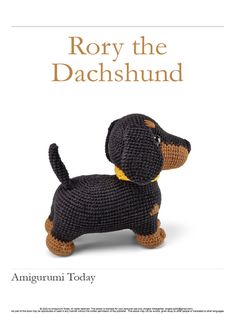 a crocheted black and brown dog sitting on top of a white background with the words roxy the dachshund