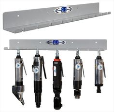 four different types of hydraulic jacks hanging from the ceiling and below them are also attached to brackets