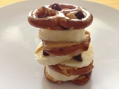 a stack of bananas and chocolate covered pretzels