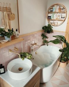 two white sinks sitting next to each other in a bathroom