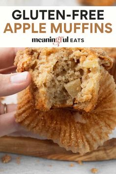 a person holding up an apple muffins with the text gluten - free apple muffins