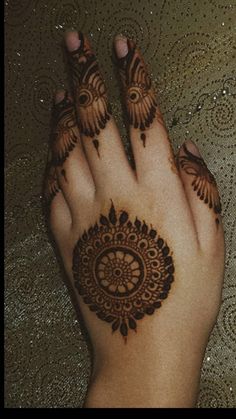 a person with henna on their hand