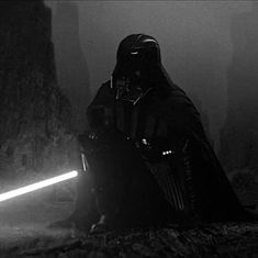 darth vader sitting in the dark with his lights on