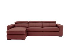 a red sectional couch sitting on top of a white floor next to a footstool