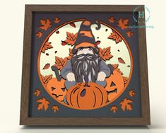 an image of a paper cut out of a gnome with pumpkins and leaves on it