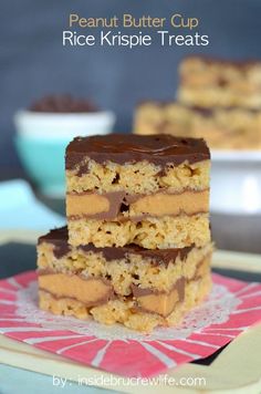 three pieces of chocolate peanut butter bars stacked on top of each other