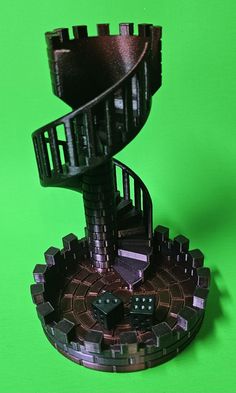 a miniature model of a spiral staircase with dice